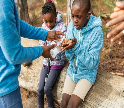 family-traveling-together-through-woods_23-2148943113